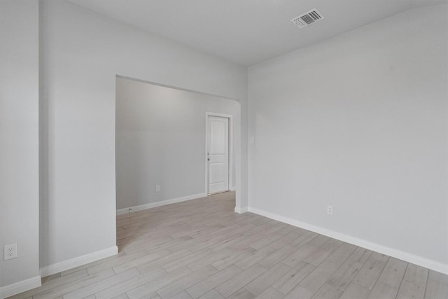 spare room featuring light hardwood / wood-style flooring