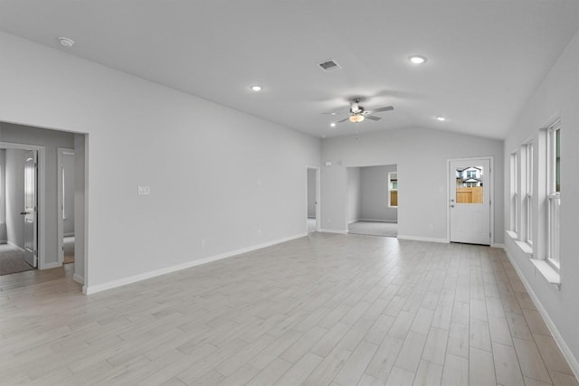 unfurnished living room featuring light hardwood / wood-style flooring, ceiling fan, and lofted ceiling