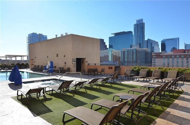 view of swimming pool featuring a patio area