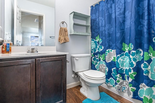13708 Sierra Wind Ln, Elgin, TX 78621 - bathroom with wood finished floors, vanity, toilet, and curtained shower