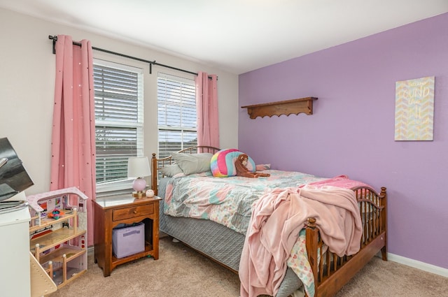 bedroom featuring light colored carpet