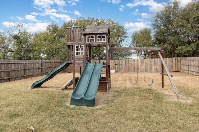 view of jungle gym featuring a lawn