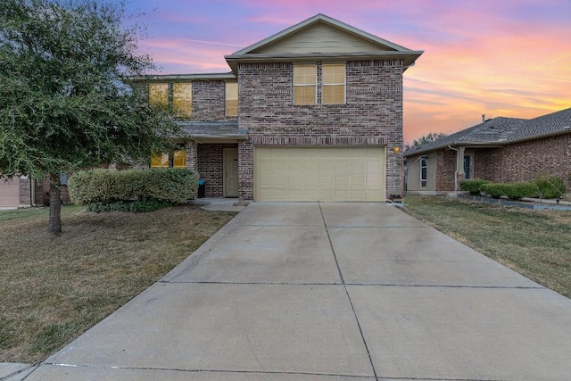 13708 Sierra Wind Ln, Elgin, TX 78621 - traditional-style home featuring driveway, an attached garage, brick siding, and a yard