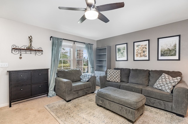 living room with ceiling fan and light colored carpet