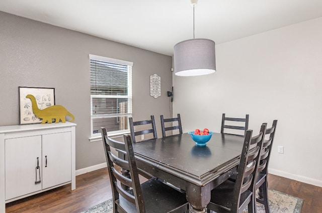 dining room with dark hardwood / wood-style flooring