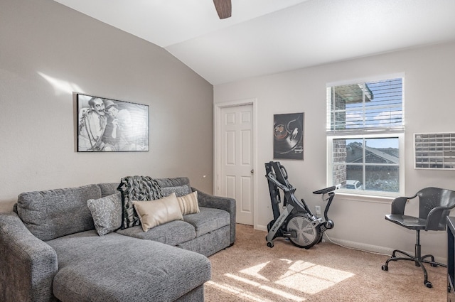 living room featuring ceiling fan, carpet floors, and vaulted ceiling