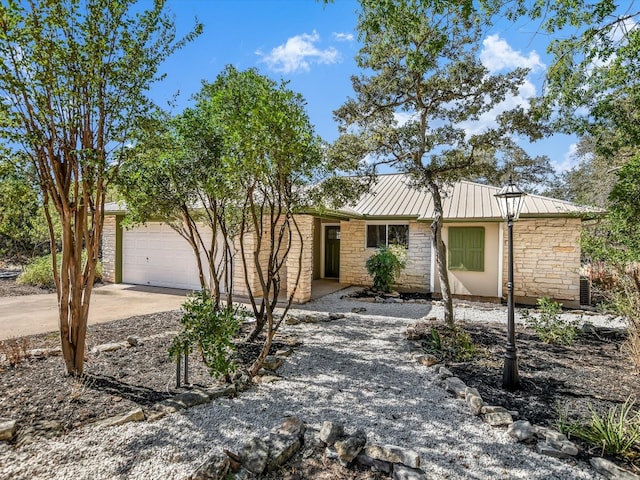 ranch-style home featuring a garage