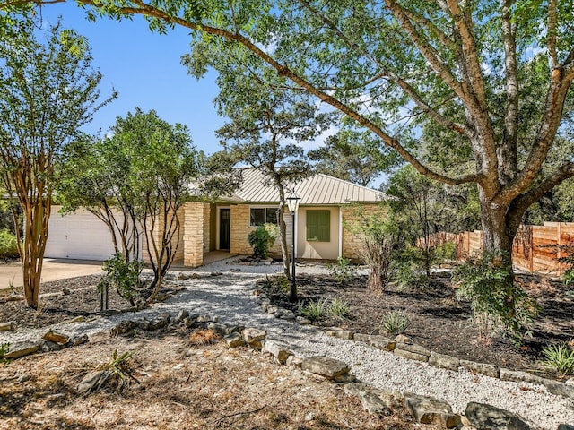 ranch-style home featuring a garage