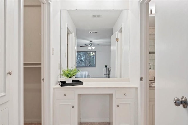 bathroom with ceiling fan and visible vents