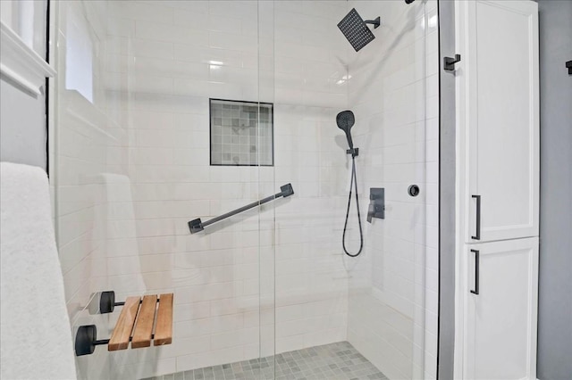 bathroom with a shower stall