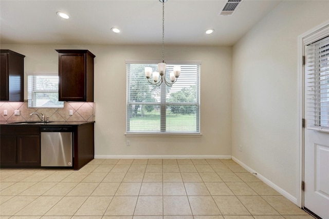 kitchen with sink, decorative light fixtures, stainless steel dishwasher, decorative backsplash, and light tile patterned floors