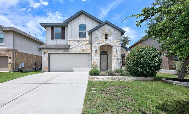 view of front of house with a front yard and a garage