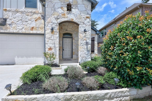 entrance to property featuring a garage