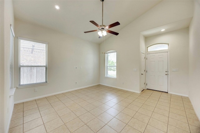 tiled entryway featuring high vaulted ceiling and ceiling fan