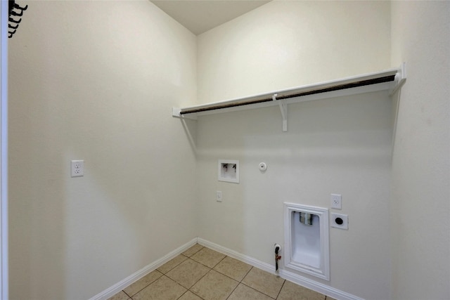 clothes washing area with electric dryer hookup, washer hookup, gas dryer hookup, and light tile patterned flooring