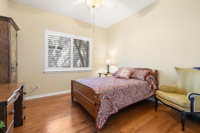 bedroom with hardwood / wood-style flooring and ceiling fan