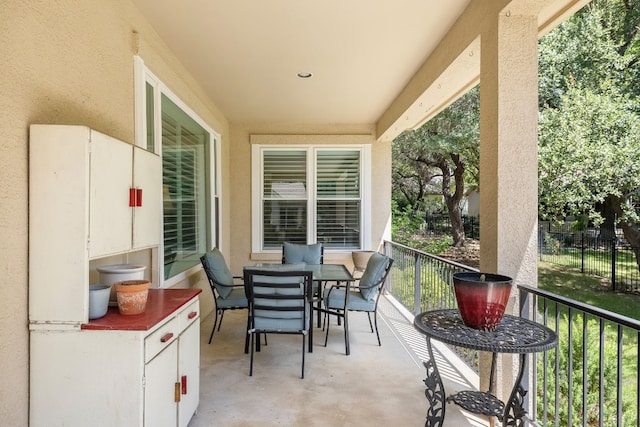 view of patio / terrace with a balcony