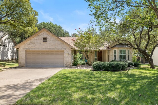 view of front of house with a front lawn and a garage