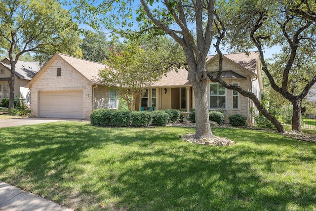 view of front facade with a garage and a front lawn