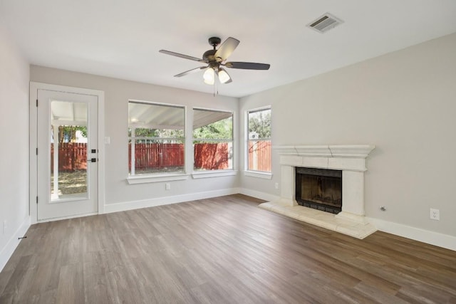 8222 Palace Pkwy, Austin, TX 78748 - unfurnished living room featuring wood finished floors, a fireplace, and ceiling fan