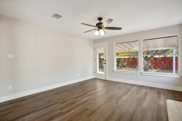 spare room featuring ceiling fan and hardwood / wood-style flooring