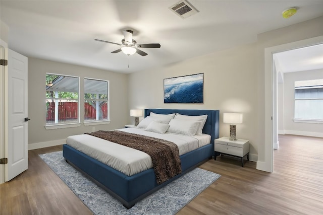 bedroom with ceiling fan and hardwood / wood-style floors