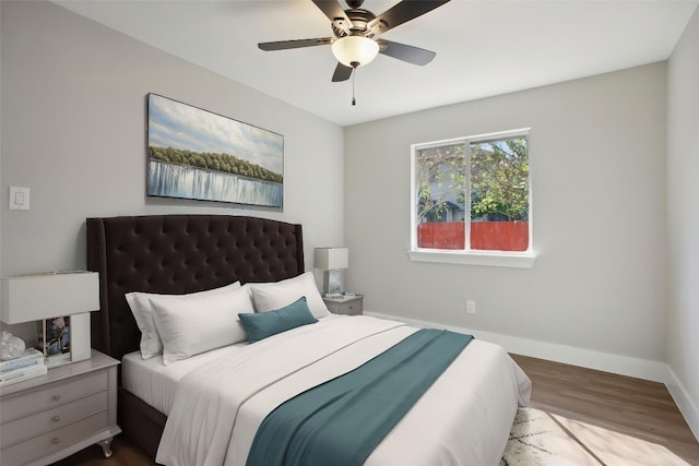 8222 Palace Pkwy, Austin, TX 78748 - bedroom featuring baseboards, wood finished floors, and ceiling fan