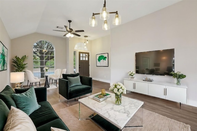 8222 Palace Pkwy, Austin, TX 78748 - living room with wood finished floors, a ceiling fan, and vaulted ceiling