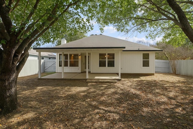 8222 Palace Pkwy, Austin, TX 78748 - back of house featuring a chimney, a fenced backyard, a patio area, and a gate
