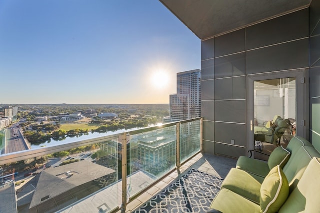 balcony featuring a water view