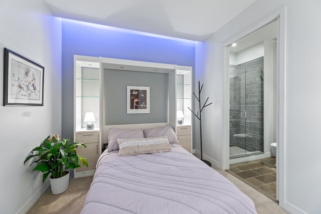 bedroom featuring carpet flooring and connected bathroom