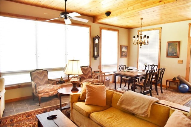 tiled living room with ceiling fan with notable chandelier and wood ceiling