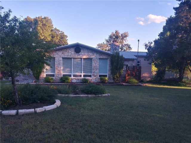 single story home with a front yard