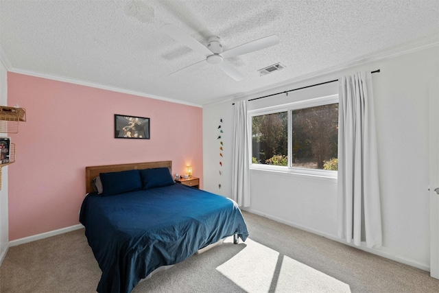 carpeted bedroom with ornamental molding, a textured ceiling, and ceiling fan