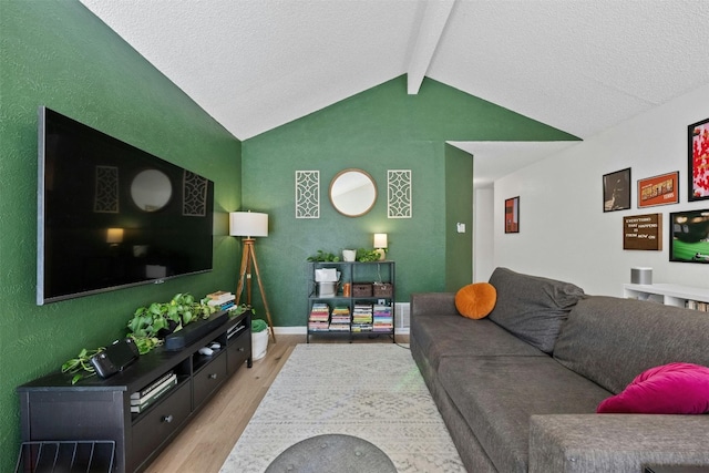 living room with lofted ceiling with beams and light wood-type flooring