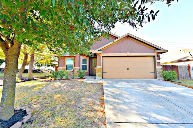 view of front of home with a front yard and a garage