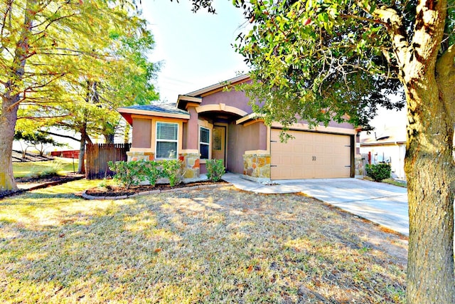 view of front facade with a front yard and a garage