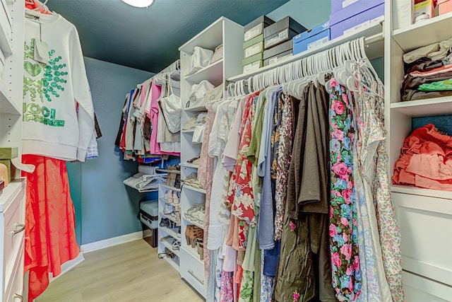 walk in closet featuring light wood-type flooring