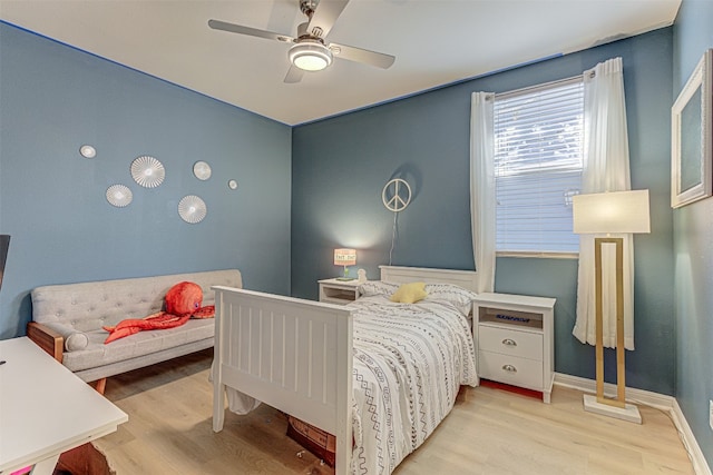 bedroom with light wood-type flooring and ceiling fan