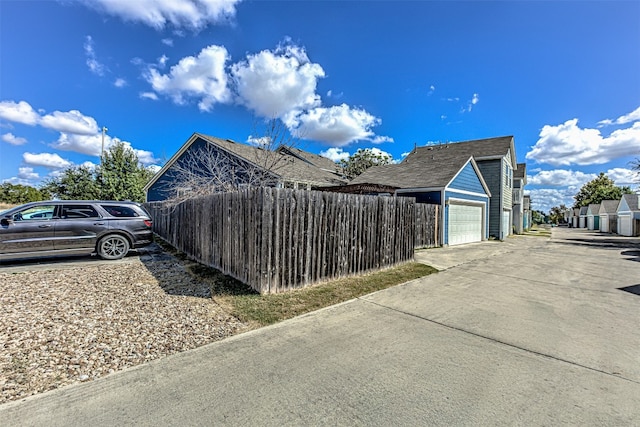 view of side of home with a garage