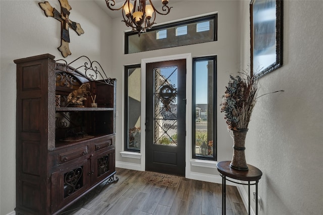 entryway with a notable chandelier and hardwood / wood-style flooring