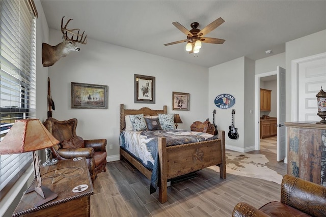 505 John Price St, Blanco, TX 78606 - bedroom featuring light wood-style flooring and ceiling fan