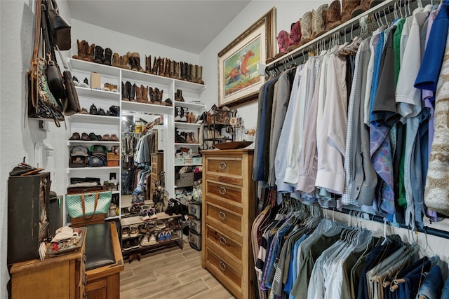 spacious closet featuring light hardwood / wood-style floors