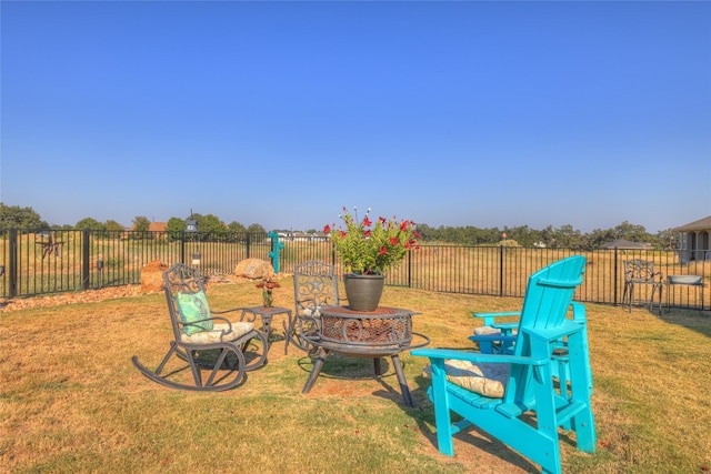 view of yard with an outdoor fire pit