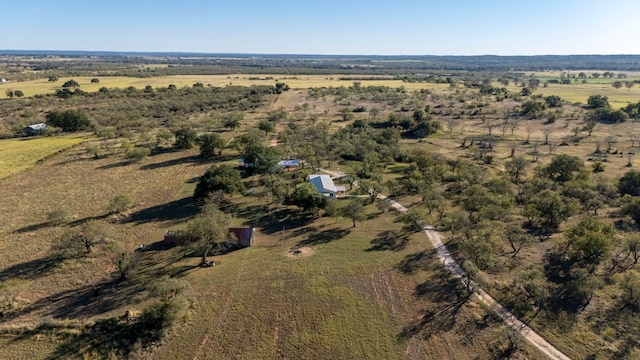 birds eye view of property featuring a rural view