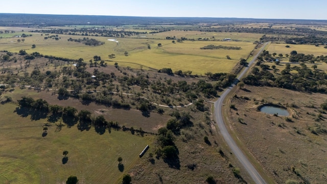 birds eye view of property featuring a rural view