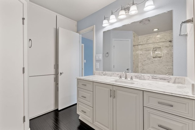 bathroom featuring vanity and wood finished floors