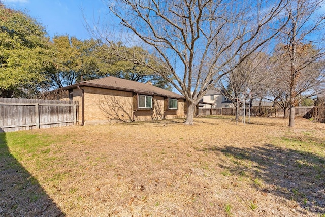 view of yard with a fenced backyard