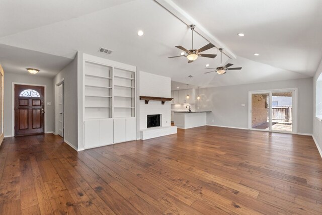 6803 Fence Line Dr, Austin, TX 78749 - unfurnished living room featuring ceiling fan, plenty of natural light, hardwood / wood-style flooring, a fireplace, and recessed lighting