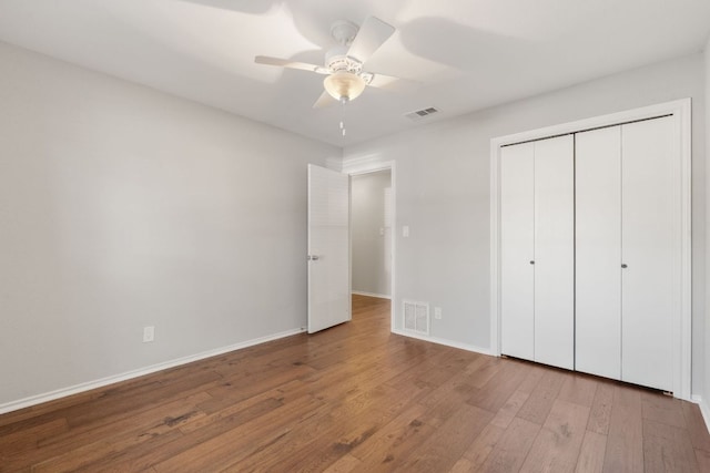 6803 Fence Line Dr, Austin, TX 78749 - unfurnished bedroom with wood finished floors, baseboards, a closet, and a ceiling fan